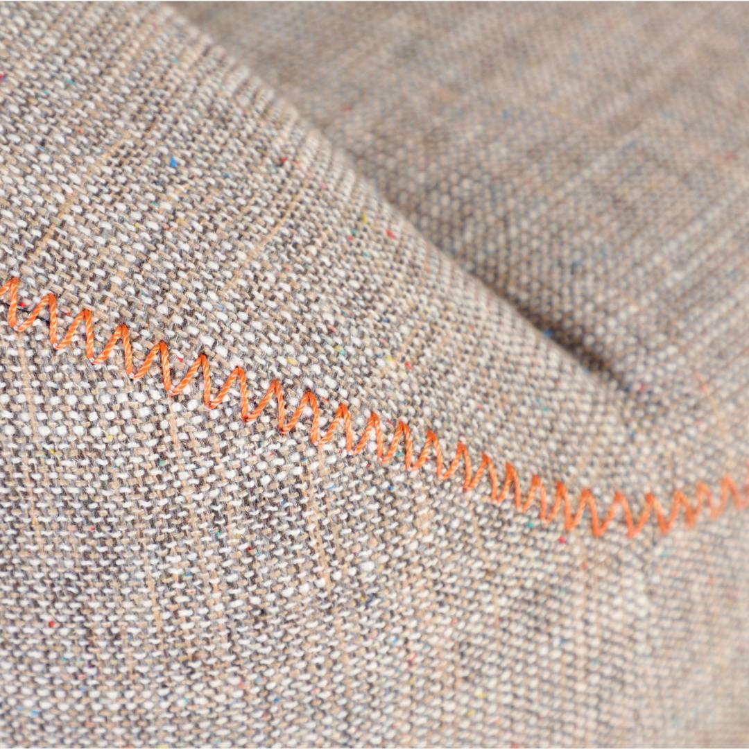 Brown Fabric with Orange Stitches